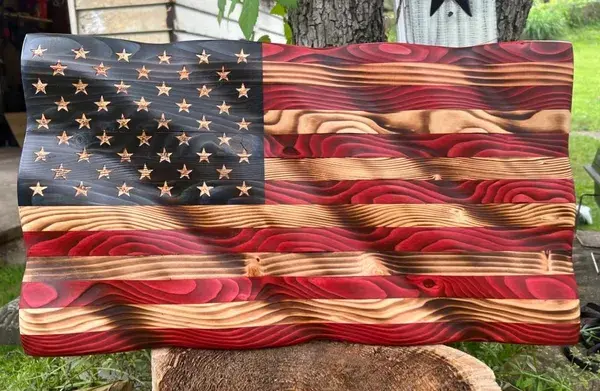 We offer handmade wooden plaques and flags. Each piece is created and signed by my husband and me, who are proud J6ers. All processing times listed on each item are an estimate and may vary depending on workload. Promo code HISGLORY for 10% off